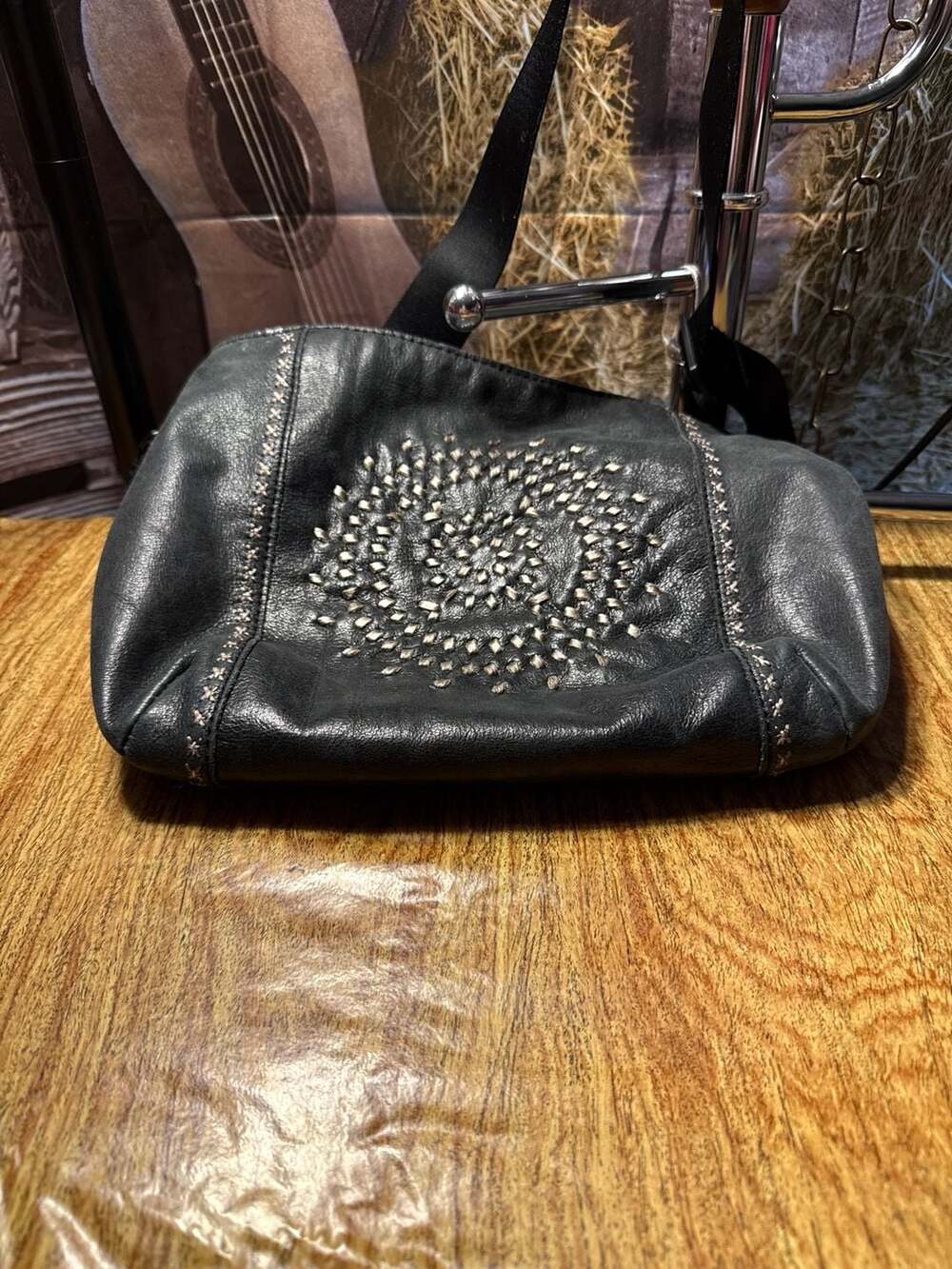 The Sak Black Leather Crossbody Bag with Woven Circle Detail